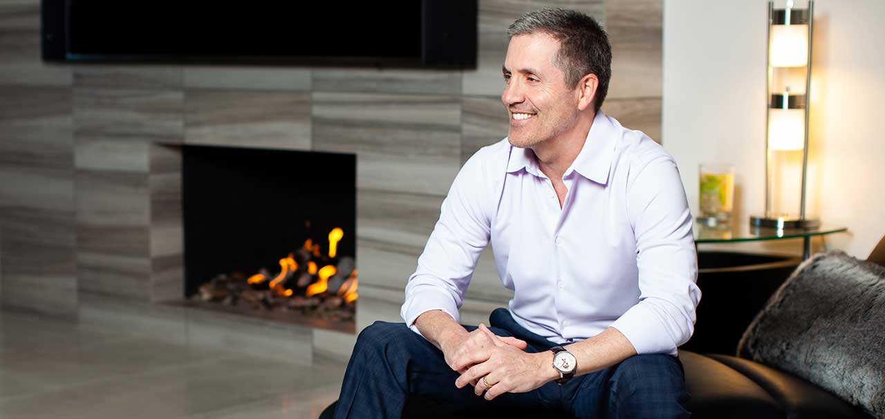 Founder & Scottsdale Luxury Real Estate Agent, Robert Altshuler, sitting in home wearing watch