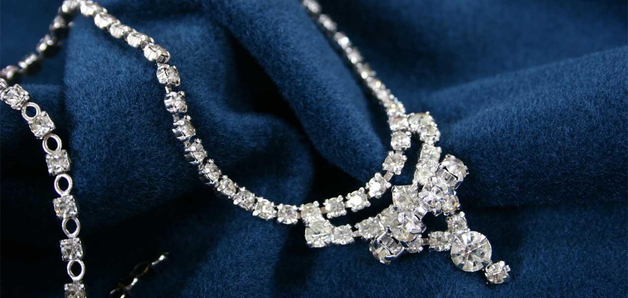 Luxury diamond necklace on blue fabric